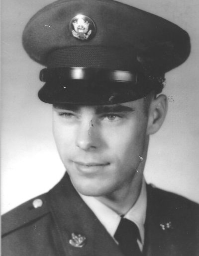 A man in uniform is wearing an army hat.