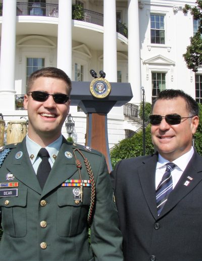 Two men in military uniforms standing next to each other.