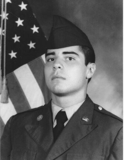 A man in uniform with an american flag.