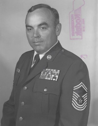 A black and white photo of an older man in uniform.